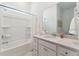 Bright bathroom with tub-shower combination, single sink vanity and stylish finishes at 1140 Darling St, Summerville, SC 29485