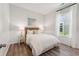 Cozy bedroom with wood-look flooring and ample natural light from the window at 1140 Darling St, Summerville, SC 29485