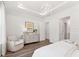 Spacious primary bedroom with tray ceiling, and large windows overlooking the wooded backyard at 1140 Darling St, Summerville, SC 29485