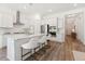Modern kitchen with white cabinets, stainless steel appliances, and quartz countertops at 1140 Darling St, Summerville, SC 29485