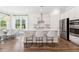 Bright kitchen featuring a central island with stylish seating and stainless steel appliances at 1140 Darling St, Summerville, SC 29485