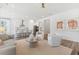 A cozy living area featuring modern decor, an open floor plan, and a seamless transition to the kitchen at 1140 Darling St, Summerville, SC 29485