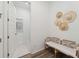 Functional mud room with a bench, hat decor and access to laundry room at 1140 Darling St, Summerville, SC 29485