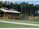 Community pavilion with a metal roof overlooks the water and features a spacious, shaded area for gatherings at 1140 Darling St, Summerville, SC 29485