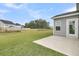 Backyard with lush green grass, a patio, and view of pond at 121 Grange Cir, Summerville, SC 29486