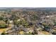 Aerial view showcasing homes nestled among dense trees, highlighting the neighborhood's lush greenery at 1217 Bamboo Dr, Charleston, SC 29407