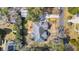 An aerial view of a charming home surrounded by lush trees and a well-maintained landscape at 1217 Bamboo Dr, Charleston, SC 29407