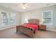 Bedroom with large windows, ceiling fan, and neutral carpet at 1217 Bamboo Dr, Charleston, SC 29407