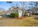 Charming home with a covered porch, well-manicured lawn, mature landscaping and attached two car garage at 1217 Bamboo Dr, Charleston, SC 29407