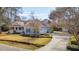 Charming home with a covered porch, well-manicured lawn, mature landscaping and attached two car garage at 1217 Bamboo Dr, Charleston, SC 29407