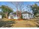 Well-maintained home exterior with a screened porch and lush green lawn at 1217 Bamboo Dr, Charleston, SC 29407