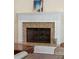 Close up of the fireplace with granite surround and white mantel, a great feature for cooler nights at 1217 Bamboo Dr, Charleston, SC 29407