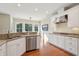 The kitchen features granite countertops, stainless steel appliances, and wood flooring at 1217 Bamboo Dr, Charleston, SC 29407