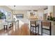 Well-lit kitchen with stainless steel appliances, granite countertops, and adjacent dining area at 1217 Bamboo Dr, Charleston, SC 29407