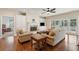 Cozy living room with a fireplace, built-in cabinets, and access to the screened in porch at 1217 Bamboo Dr, Charleston, SC 29407