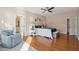 Bright main bedroom with wood floors, ceiling fan, ensuite bath, and sitting area at 1217 Bamboo Dr, Charleston, SC 29407