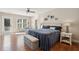 Bright main bedroom with a ceiling fan, hardwood floors, and a decorative headboard at 1217 Bamboo Dr, Charleston, SC 29407
