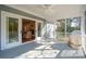 Screened-in porch offers view to interior and exterior spaces at 1217 Bamboo Dr, Charleston, SC 29407