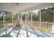 Large screened-in porch with bright lighting and white trimming, perfect for outdoor entertaining at 1217 Bamboo Dr, Charleston, SC 29407