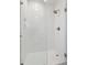 A modern walk-in shower features bright white tiling, glass enclosure and sleek fixtures at 1217 Bamboo Dr, Charleston, SC 29407
