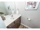 Bathroom featuring a white sink with wood cabinets, a mirror, and a fox picture on the wall at 123 Lakelyn Rd, Moncks Corner, SC 29461