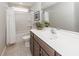 Bathroom featuring a white shower and tub combination, brown cabinets, and a white sink at 123 Lakelyn Rd, Moncks Corner, SC 29461