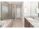 A bathroom with a walk-in shower, tub, granite countertops, and tile floors at 123 Lakelyn Rd, Moncks Corner, SC 29461