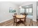 Cozy dining area with wood floors, natural light, and comfortable seating at 123 Lakelyn Rd, Moncks Corner, SC 29461