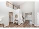 Bright foyer with soaring ceilings, wood floors, and decorative wall accents at 123 Lakelyn Rd, Moncks Corner, SC 29461