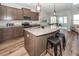 A kitchen with a large island, pendant lighting, stainless steel appliances, and hardwood floors at 123 Lakelyn Rd, Moncks Corner, SC 29461