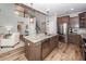 A kitchen with stainless steel appliances, an island, gray cabinets, and hardwood floors at 123 Lakelyn Rd, Moncks Corner, SC 29461