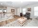 Cozy living room features wood floors, neutral walls, and a comfortable gray recliner at 123 Lakelyn Rd, Moncks Corner, SC 29461