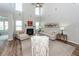 Bright living room featuring a fireplace, tall ceilings, and comfortable seating at 123 Lakelyn Rd, Moncks Corner, SC 29461