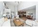 Open concept living area with soaring ceilings seamlessly connecting to the kitchen at 123 Lakelyn Rd, Moncks Corner, SC 29461