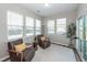 A sunroom with hardwood floors, bright lighting, and comfortable seating at 123 Lakelyn Rd, Moncks Corner, SC 29461