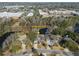 Aerial view of 1249 Waterfront Dr showing its neighborhood and surrounding wooded and commercial areas at 1249 Waterfront Dr, Mount Pleasant, SC 29464