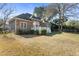 Well-maintained backyard features a white deck, lush green grass, and mature trees, great for outdoor living at 1249 Waterfront Dr, Mount Pleasant, SC 29464