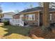 Backyard with wooden deck area and lawn, surrounded by mature trees and green space for privacy at 1249 Waterfront Dr, Mount Pleasant, SC 29464