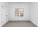 Cozy bedroom with a large window, soft carpet, and a closet for storage at 1249 Waterfront Dr, Mount Pleasant, SC 29464