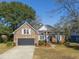 Lovely brick home with a two-car garage and arched window detail, situated on a well-kept lawn at 1249 Waterfront Dr, Mount Pleasant, SC 29464