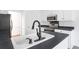 Well-equipped kitchen featuring modern appliances, a stylish faucet, and dark countertops at 1249 Waterfront Dr, Mount Pleasant, SC 29464