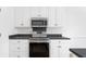 Modern kitchen with stainless steel appliances, sleek countertops, and white cabinets at 1249 Waterfront Dr, Mount Pleasant, SC 29464