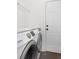Bright laundry area boasts a modern Samsung washer and dryer set and convenient storage shelves at 1249 Waterfront Dr, Mount Pleasant, SC 29464