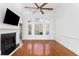 Spacious living room features hardwood floors, a fireplace, and large windows for natural light at 1249 Waterfront Dr, Mount Pleasant, SC 29464