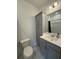 Stylish bathroom with gray cabinets, sink and commode, offering a clean and modern look at 1252 Allusion Ln # 201, Mount Pleasant, SC 29466