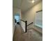 Hallway with carpet flooring, white walls, a window, and a view into another room at 1252 Allusion Ln # 201, Mount Pleasant, SC 29466