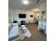 Bright living room with hardwood floors, modern furnishings, and an open concept layout to kitchen at 1252 Allusion Ln # 201, Mount Pleasant, SC 29466