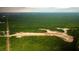 Expansive aerial shot shows new construction development nestled among mature woodlands and tranquil water features at 127 Lilac Grove Way, Summerville, SC 29486