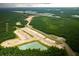 Aerial view of the land development, community surrounded by trees and ponds at 127 Lilac Grove Way, Summerville, SC 29486