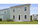 Home backyard featuring a lawn, door, and vinyl siding at 127 Lilac Grove Way, Summerville, SC 29486
